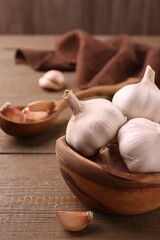 Fresh garlic on wooden table, closeup view