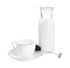 Milk frother wand, cup and glass carafe isolated on white