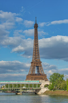 Serenity in Spring: Eiffel Tower, Seine River & Metro Train Crossing Bridge