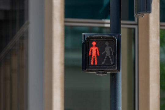 Iconic Red Pedestrian Traffic Light in Paris, France - Urban Street Scene