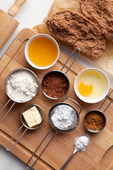 Gingerbread dough for Christmas and ingredients for making dough - egg, honey, spice, powdered...