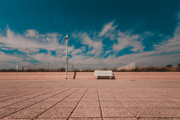 empty bench on a seaside promenade