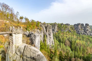 Rideaux tamisants Le pont de la Bastei Bastei Bridge stands majestically among towering sandstone formations and lush greenery in Saxon Switzerland National Park, Germany