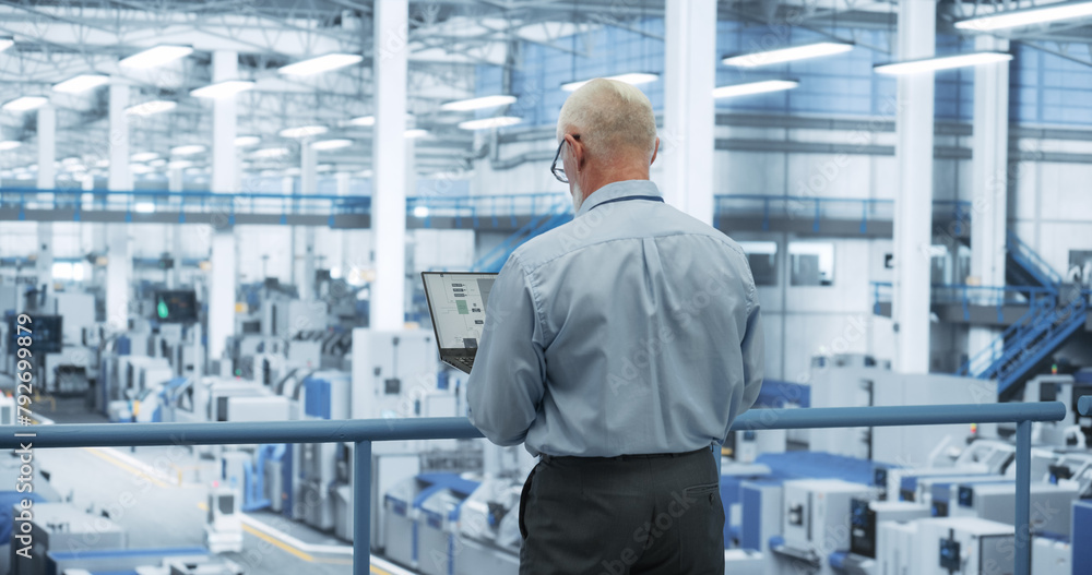 Aufkleber Middle Aged Engineer Monitoring and Analyzing Conditions at an Automated Modern Electronics Factory with Mobility Robots Working with the Help of Artificial Intelligence Software
