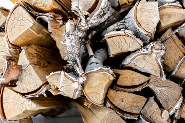 chopped firewood in close-up. preparation of resources for heating the house in winter