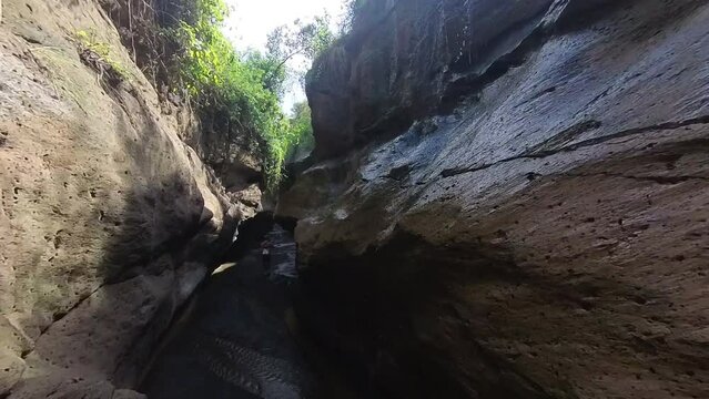 Woman hiking through Hell&rsquo;s gate national park in Kenya
