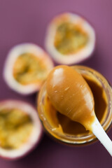 Passion fruit and spoon with caramel