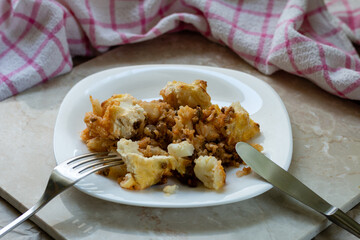 Cauliflower casserole served on a plate.