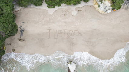 Aerial view of the sand written Just Go