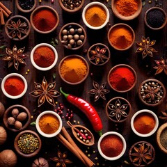 Obraz na płótnie Canvas Spices and herbs, cooking ingredients condiments, top down view on wooden background