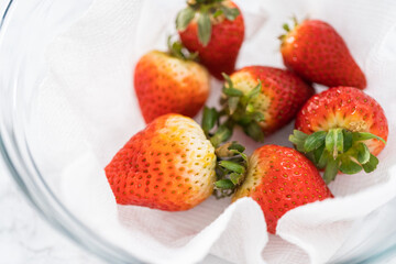 Washed and Dried Strawberries Neatly Stored in a Glass Bowl - 792728873