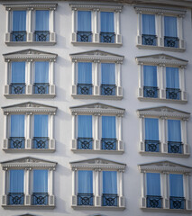 Azure Elegance. A Hotel's Blue Windows Symphony. Pattern and texture.
