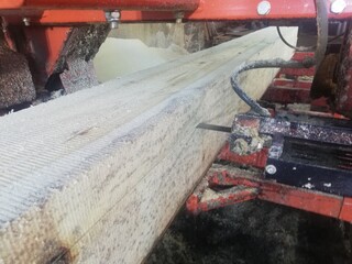 wood processing. Sawmill cutting log process of making wood planks
