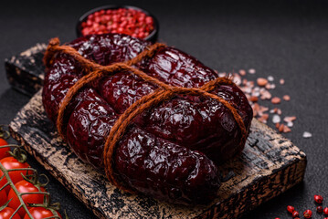 Delicious black blood sausage or black pudding with spices and herbs
