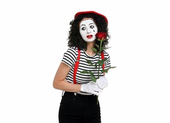 Funny mime with red rose posing on white background