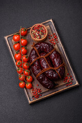 Delicious black blood sausage or black pudding with spices and herbs