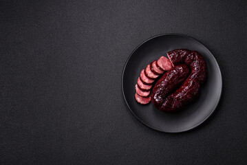 Delicious black blood sausage or black pudding with spices and herbs