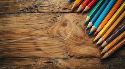 Vibrant Array of Artistic Pencils on Wooden Surface - obrazy, fototapety, plakaty