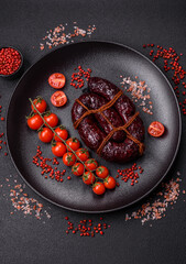 Delicious black blood sausage or black pudding with spices and herbs