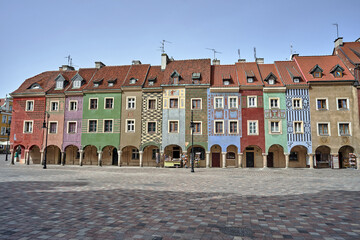 facades of historic tenement houses with arcades on the market square in Poznan