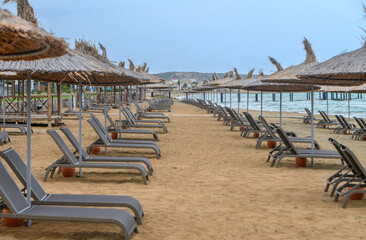 Mediterranean beach with sun loungers and sun umbrellas 5