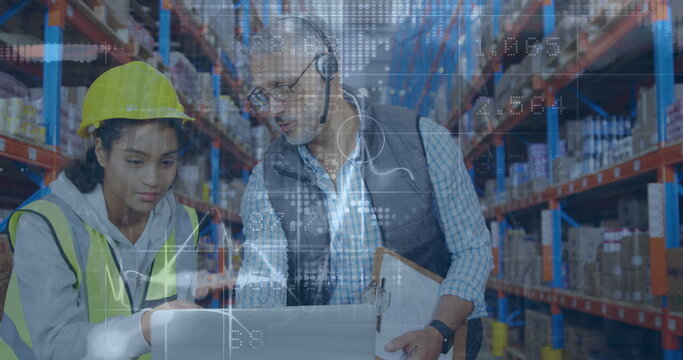 Image of financial graphs over happy diverse male and female warehouse workers with laptop