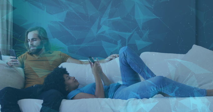 Image of data processing with shapes over diverse couple using smartphones