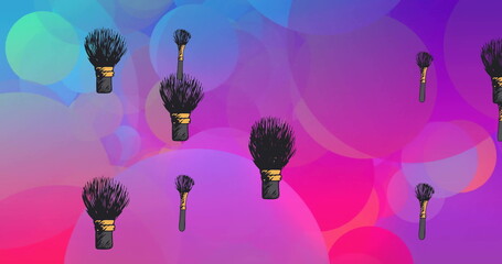 Image of makeup powder brushes over blue and pink light spots