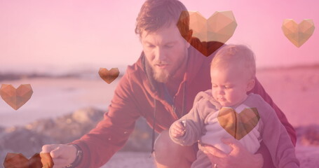 Obraz premium Image of heart icons over caucasian father with child at beach