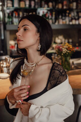 Woman Enjoying a Wine at the Bar