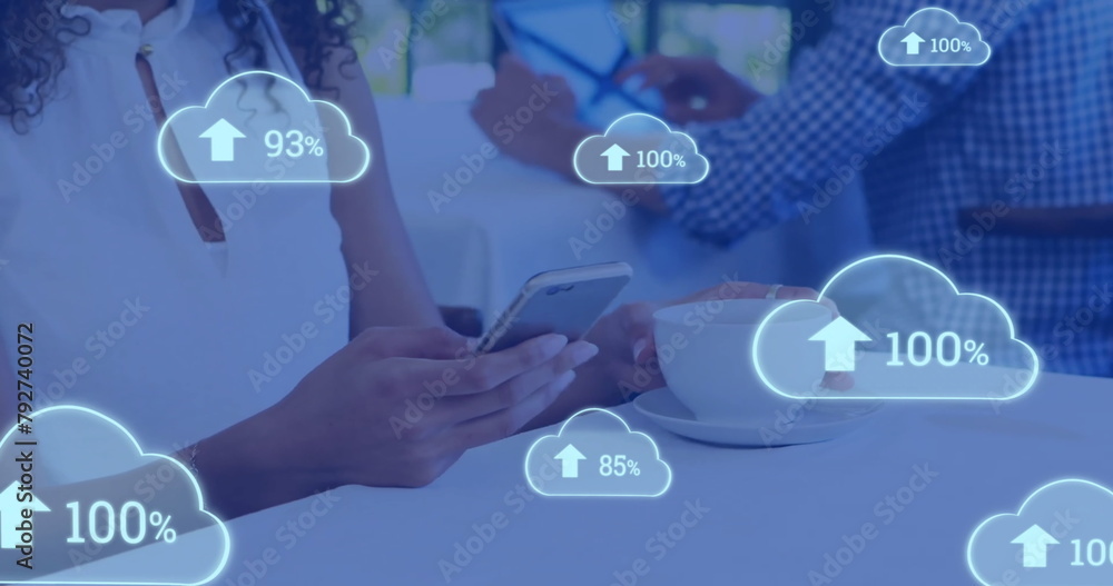 Poster image of white clouds uploading data over diverse customers in cafe using smartphone and tablet
