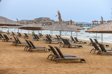 beachgoers with umbrellas on the beach of the Mediterranean Sea 5