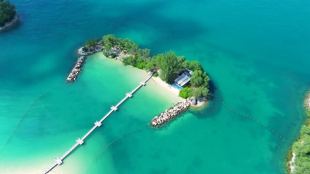 Aerial drone landscape of crystal clear ocean Ola beach club tropical reef Siloso Sentosa Island attractions Singapore travel tourism Asia