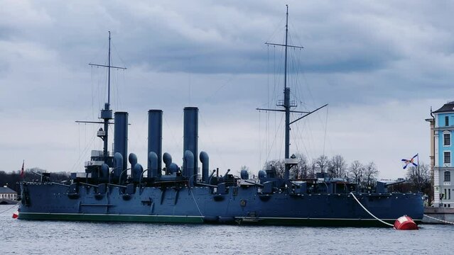 St. PETERSBURG, RUSSIA - April 20, 2024: The Aurora Cruiser Museum on the Neva River on a 20th-century warship. View of the cruiser Aurora, a historical warship, now a war memorial museum. 4К