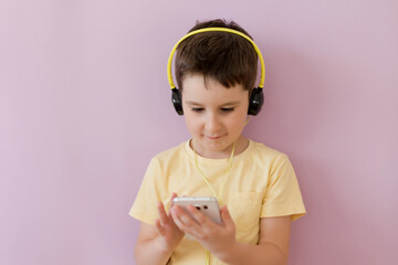 Boy with smartphone in headphones