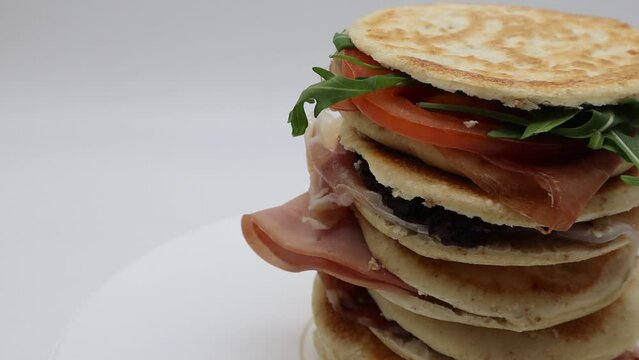 Delicious Italian Tigelle on turntable. Traditional Italian food.