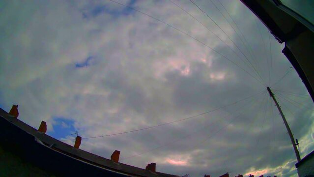 HD timelapse of clouds in the sky as they pass telephone pole wires on a sunny day.

Outputted in Rec709 color space using dream-like color tones.