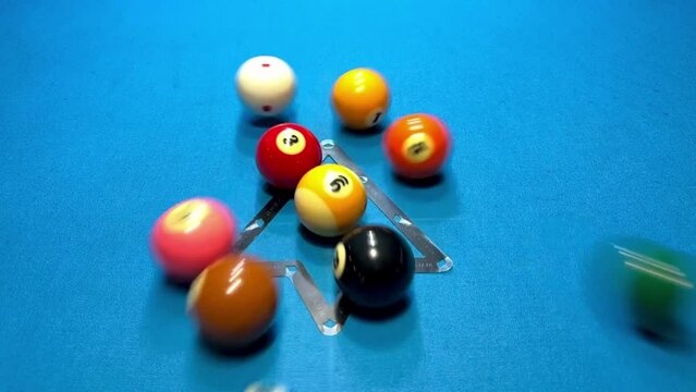 Billiard nine ball break in slow motion