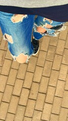 ripped jeans, street fashion. Fashion model.