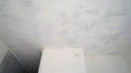 Interior of a renovated house with white wall and ceiling. Repair of walls and ceilings, apartment...