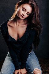 Studio portrait of beautiful teenage girl with long flowing dark hair