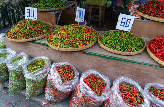 Porters,vendors and customers at Kad Luang fish and vegetable market in Chiang Mai, Thailand