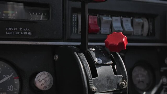 Throttle and Fuel Mixture Lever is Small Airplane Cockpit Close Up