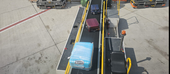 Loading Luggage Onto Airplane