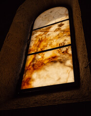 Old ancient glow marble window in the church in Israel. Selective focus