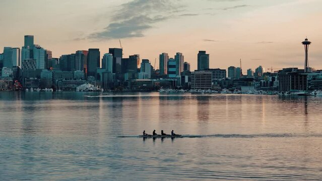 Silhouetted Rowers at Sunset on Lake Union with Seattle Skyline