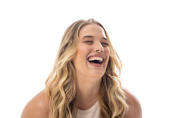 Young Caucasian female plus size model laughing, showing joy on white background, copy space - 792788687