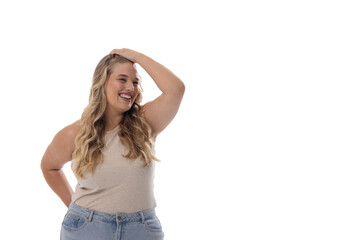 Caucasian plus-size young woman laughs, hand on head, looking sideways on white, copy space - 792788696