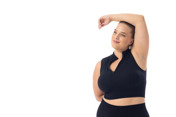 Caucasian young female plus size model on white background poses confidently, copy space - 792788856
