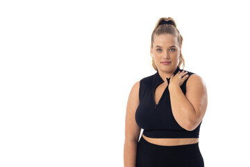Plus size Caucasian young female model in black sportswear on white background, copy space - 792788862